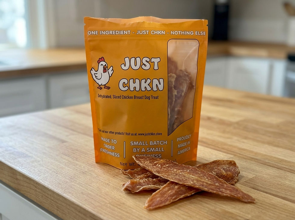 Open bag of JUST CHKN dehydrated chicken breast dog treats on a kitchen counter