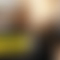 A man looking at an expensive motorcycle helmet