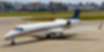 Embraer Legacy 650 large-cabin business jet parked on the runway