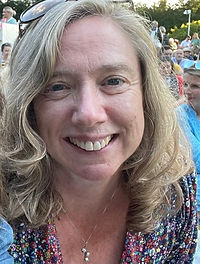 A picture of Vicky smiling.