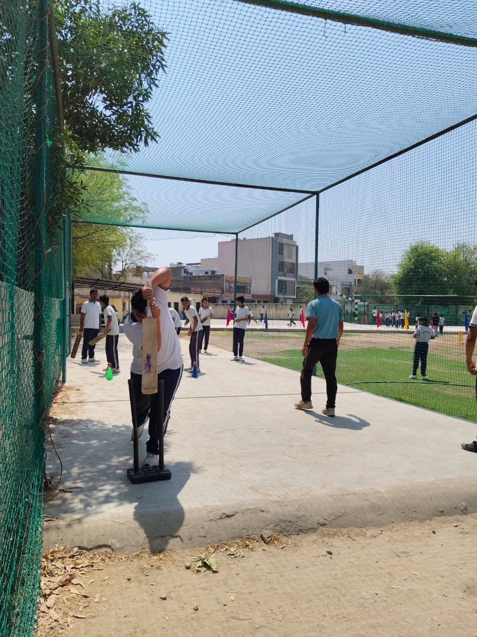 Student batting in cricket net, Affordable School in Pratap Nagar Jaipur.