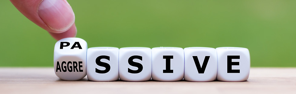 Hand turns a dice and changes the word _passive_ to _aggressive_, or vice versa..jpg