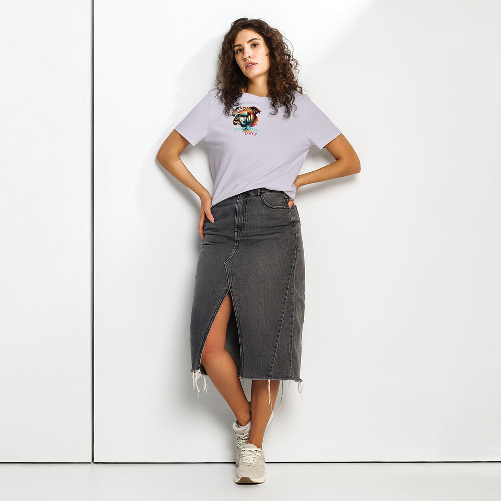 Thumbnail: Woman standing against wall in Pawsitive Vibes Only organic tshirt and blue jean skirt