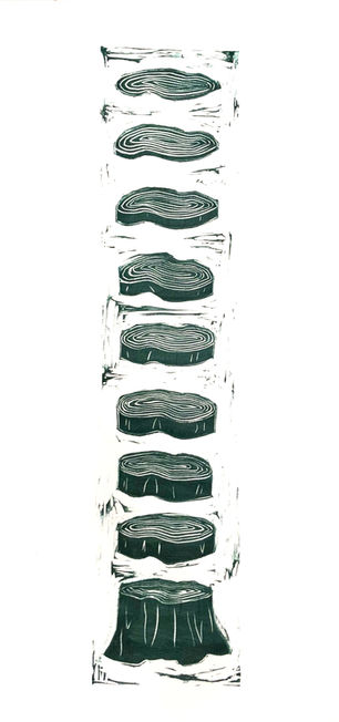 Green linocut print of a tree trunk cut into slices.