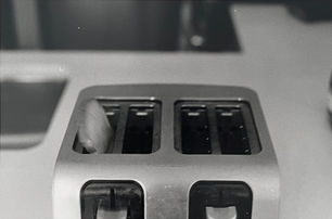 Photo of a toaster, with blurred toast popping up