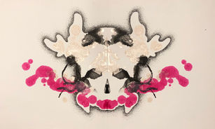 Pink, black, and gold Rorschach ink blots with skull and antlers outline