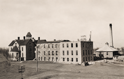 Historic circa 1913 photograph showing workers constructing the major expansion of the SDSD Girls’ Dormitory, later known as French Hall.