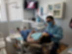  dentist works with patient in the dental chair