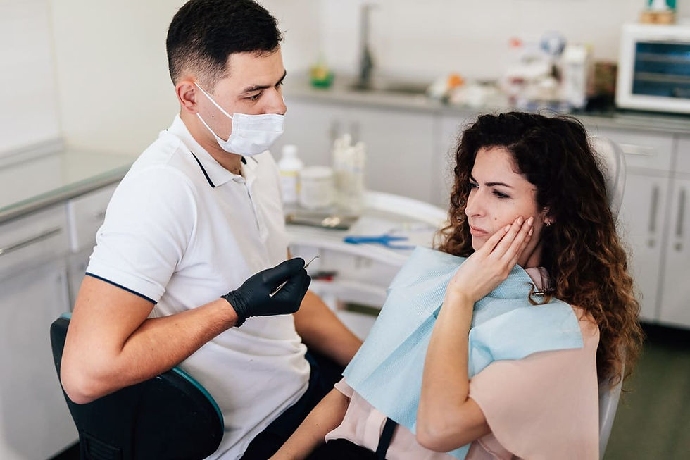 Dental Extraction Treatment for a patient experiencing tooth pain during consultation with dentist in modern dental clinic.