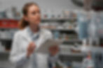 female-pharmacist-with-table-checking-stock-pharmacy_11zon.jpg