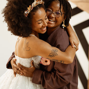 Couple happily hugging on their wedding day