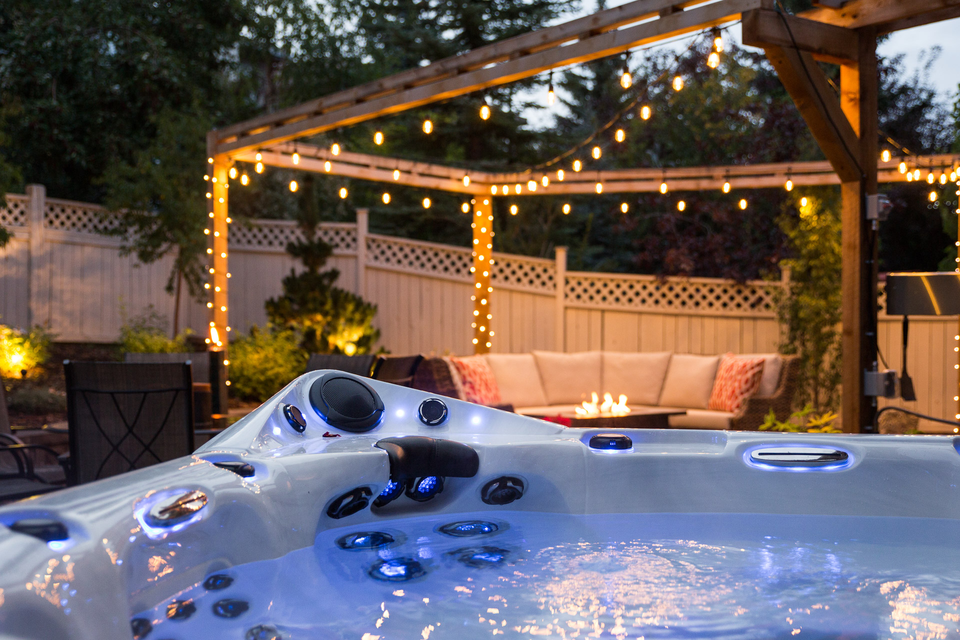 Year-Round Landscaping outdoor living project with pergola, fire feature and spa