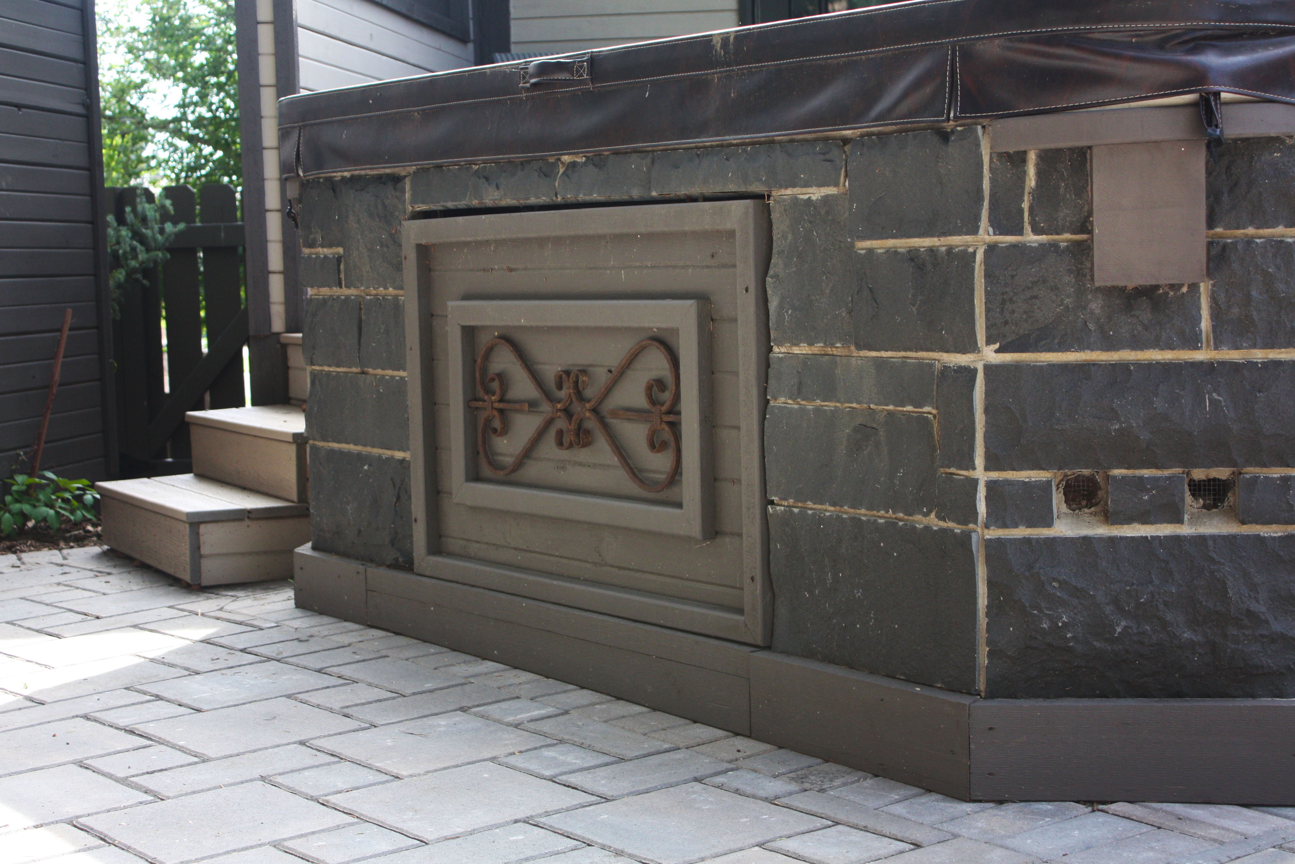 Stone masonry and custom carpentry project by Year-Round Landscaping