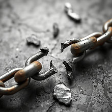 old link chain breaking one link already broken in half.jpg