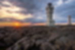 Sólsetur á Breið. Gamli Akranesviti og Akranesviti. Akranes, Iceland. Mynd: Shutterstock.