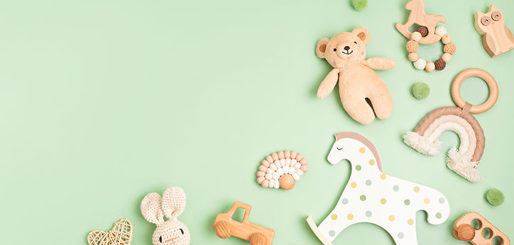 eco-friendly-wooden-baby-toys-on-green-background-2024-03-04-18-23-57-utc.jpg