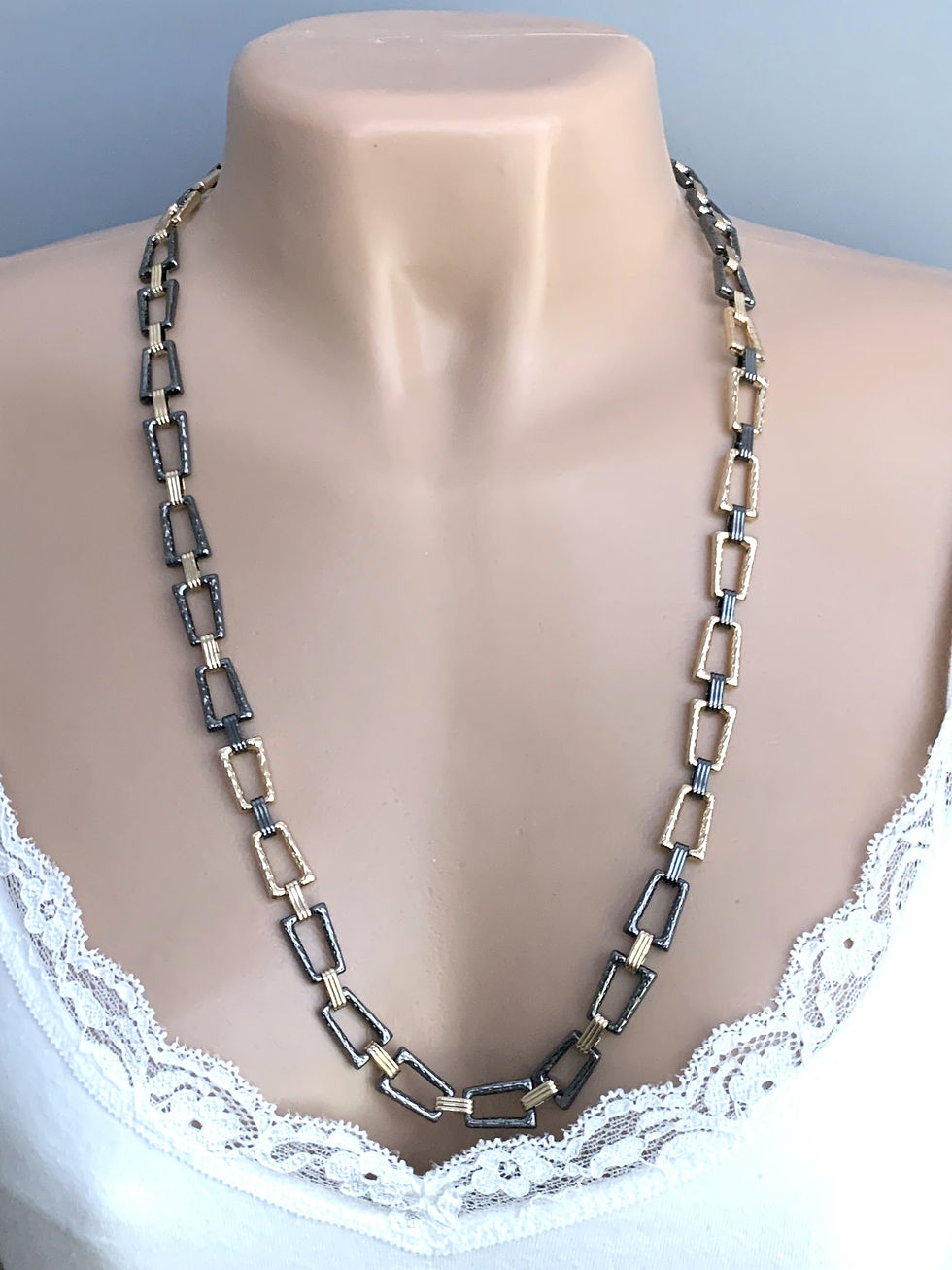 Thumbnail: Long necklace with gold and dark rectangular links