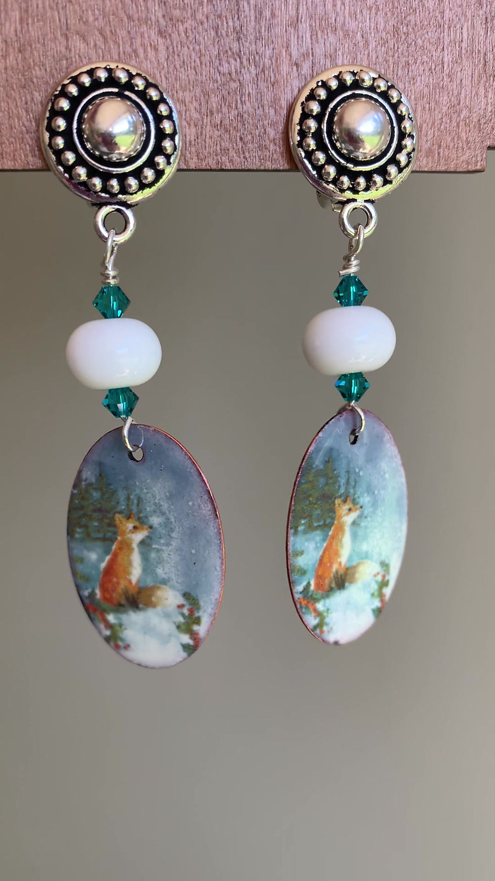 Thumbnail: A video of blue copper enamel clip on earrings with fox design