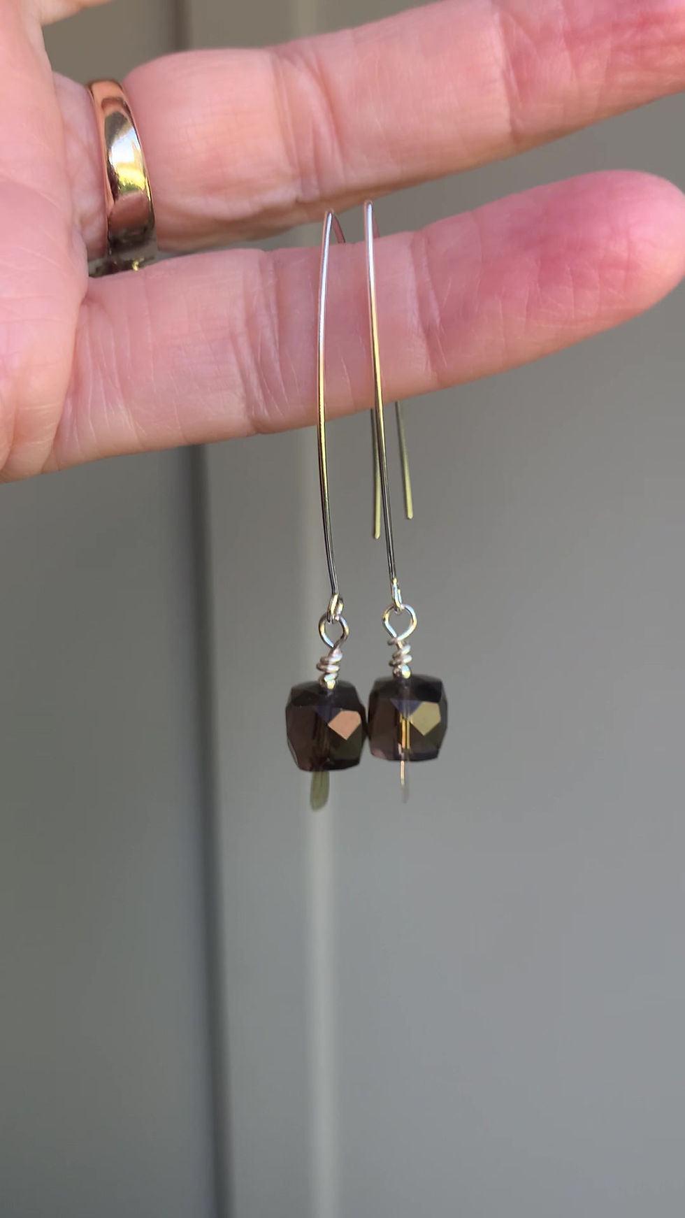 Thumbnail: A video of a pair of smoky quartz threader earrings in silver