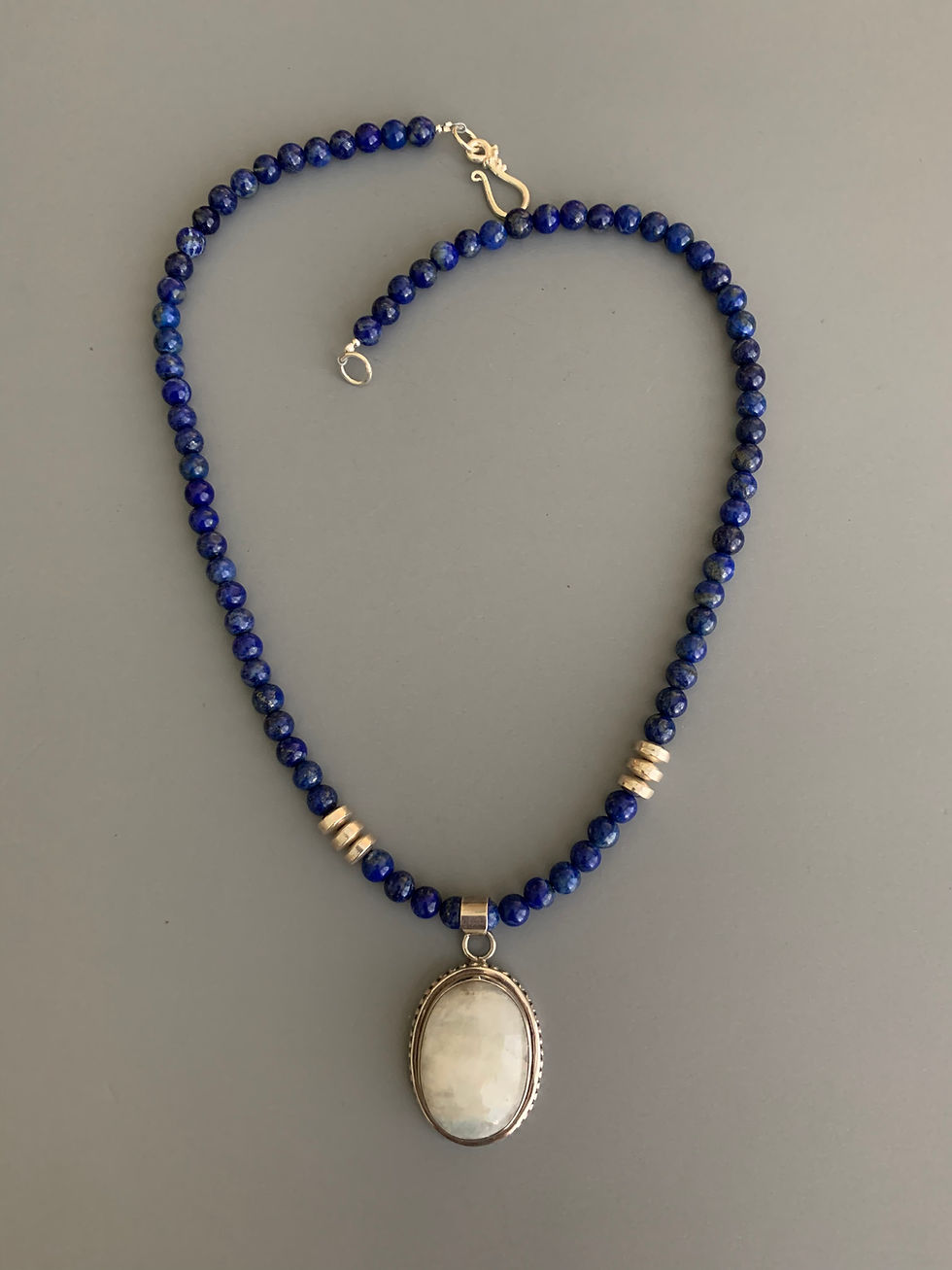 Thumbnail: Handcrafted blue beaded necklace with oval pendant