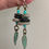 Thumbnail: Handmade Pebble Dangle Earrings: Sterling Silver, Turquoise Leaf Charm