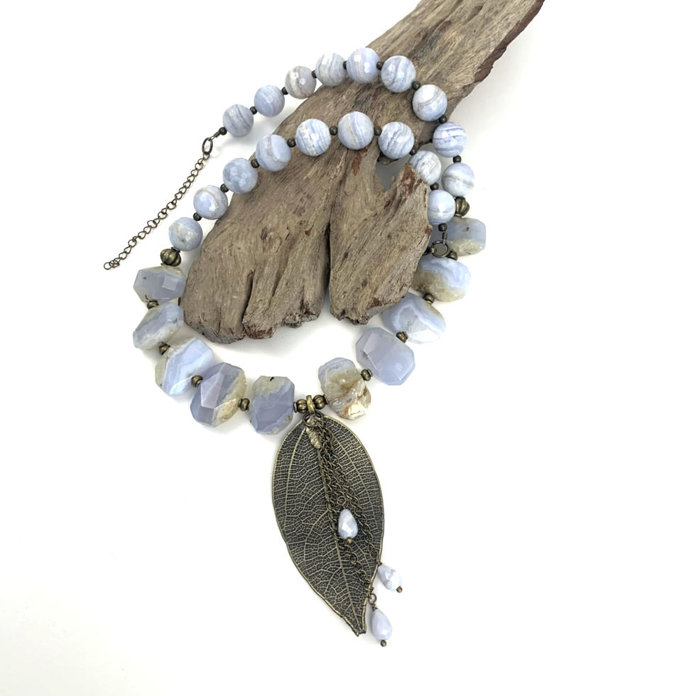 Thumbnail: Women's blue beaded necklace with a bronze leaf pendant