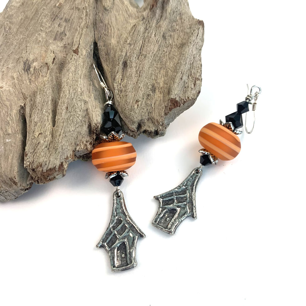 Thumbnail: Clip-on earrings with orange striped beads and spooky house charms