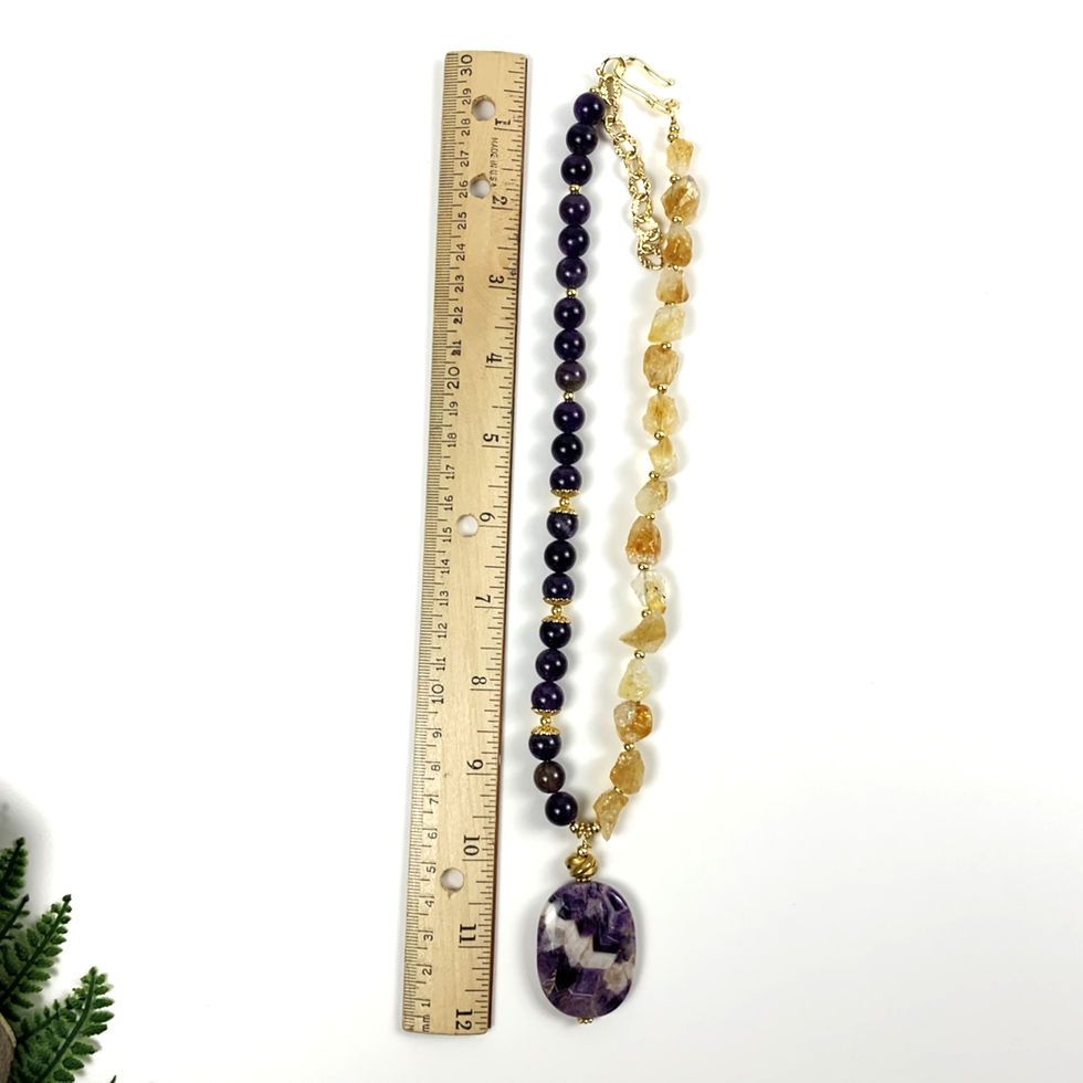 Thumbnail: Beaded necklace with purple and yellow stones, ruler for scale.