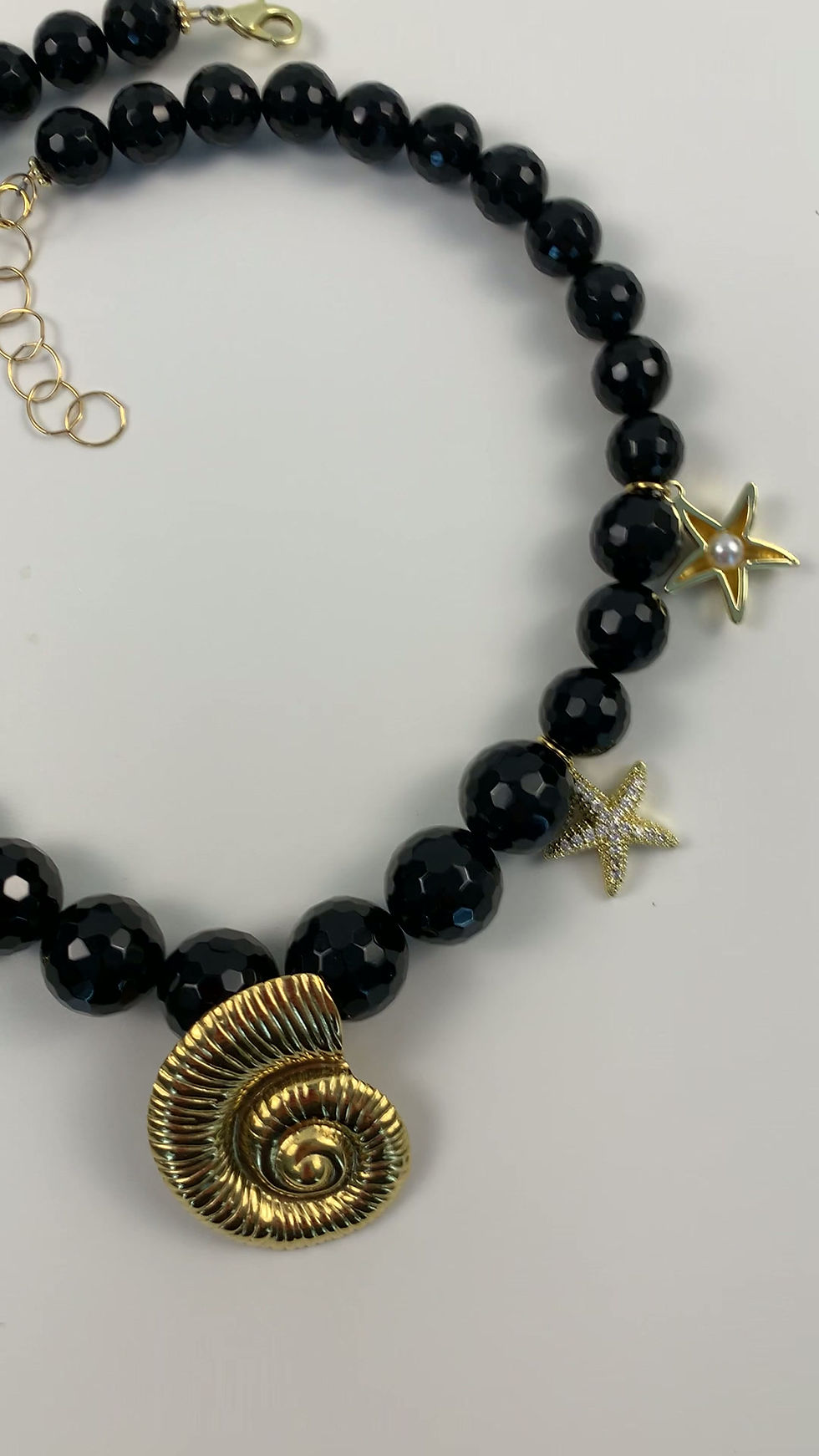 Thumbnail: Video of a handcrafted black beach style statement necklace