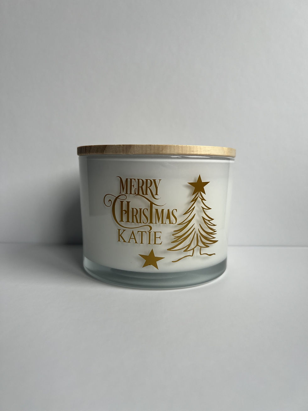 Close-up view of a hand-poured soy candle with a flickering flame