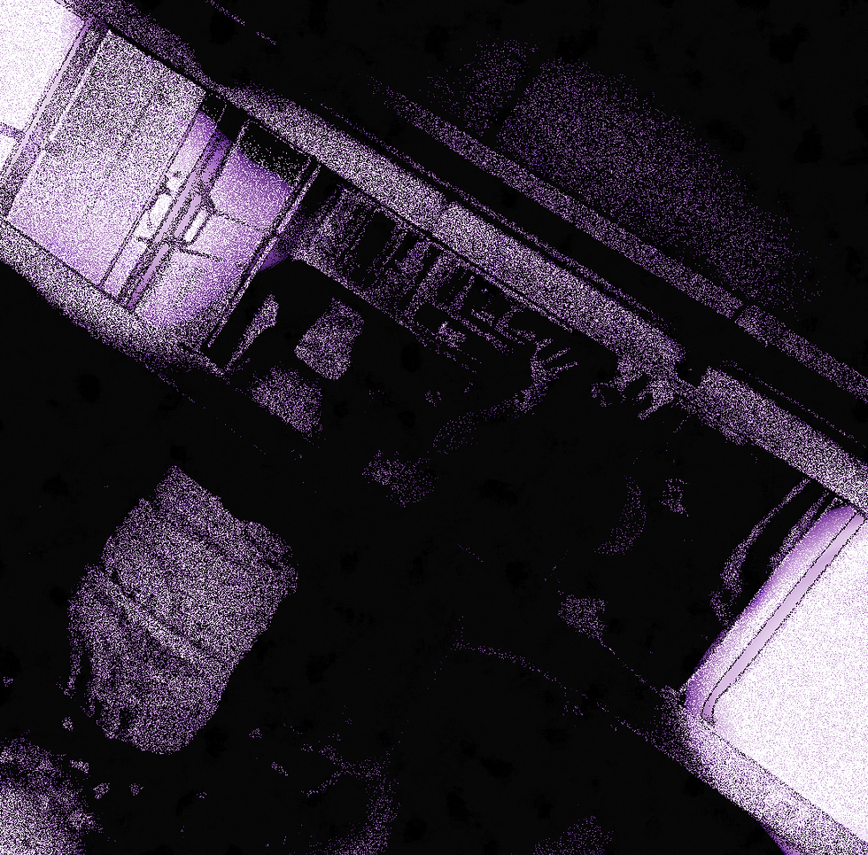 Dimly lit abstract scene with purple tones showing blurred interior elements, possibly seats and a person in motion. Quiet and mysterious mood.