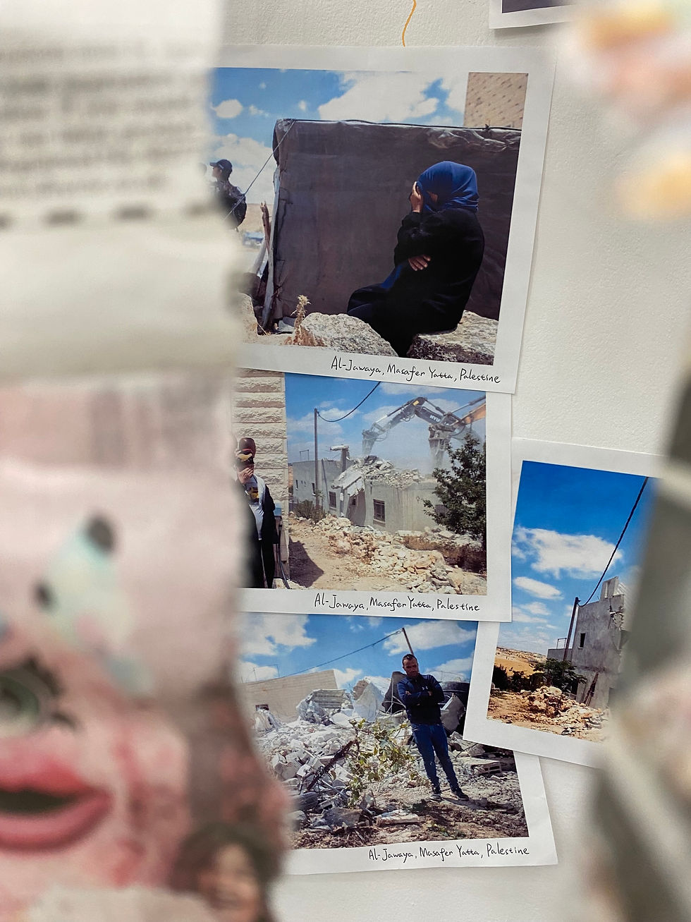 Photo of the exhibition with photos and captions of images of homes bulldozed and destroyed by the Israeli occupation in Masafar Yatta in the West Bank.