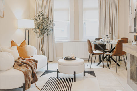 Finished staged lounge with cream tones, natural wood and black accents in a North Glasgow apartment.