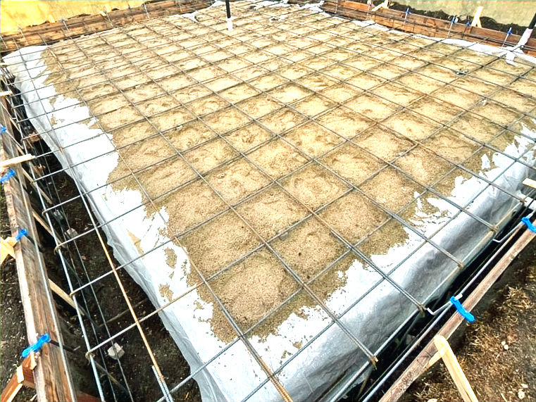 High angle view of construction workers building an ADU foundation