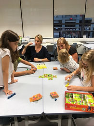 young students in a classroom with Dutch-speaking teacher