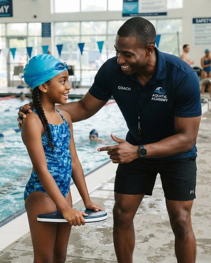Strong black male swim coach and student.jpg