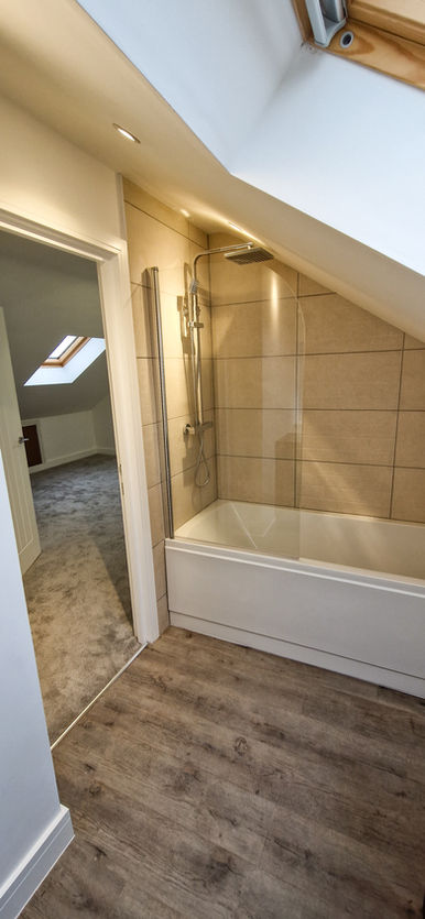 Quest bedroom with ensuite bathroom plastered by MT Plastering and Professional Finishings