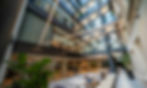 Glass atrium hero image with premium lighting and multi-level architectural interior in Dublin office building
