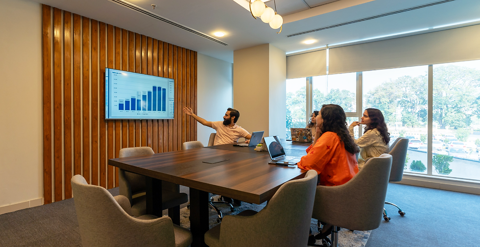 A group of coworkers in a meeting at Daftarkhwan | Vanguard.