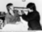 Jimmie Nicol checking Ringo's tonsils in 1964 (c) topfoto