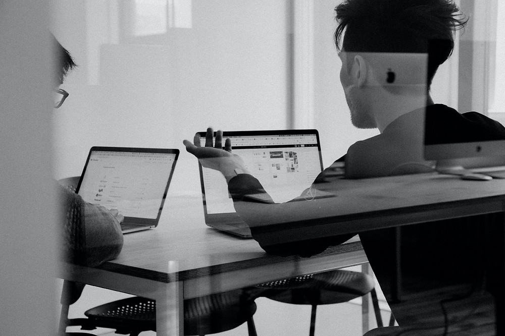 Participants of a UX user test sitting at their computers