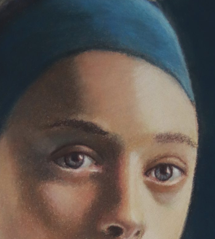 Detail of a pastel portrait study by Uri Shavit showing a green-tempered cool neutral beside the eye and under the brow.