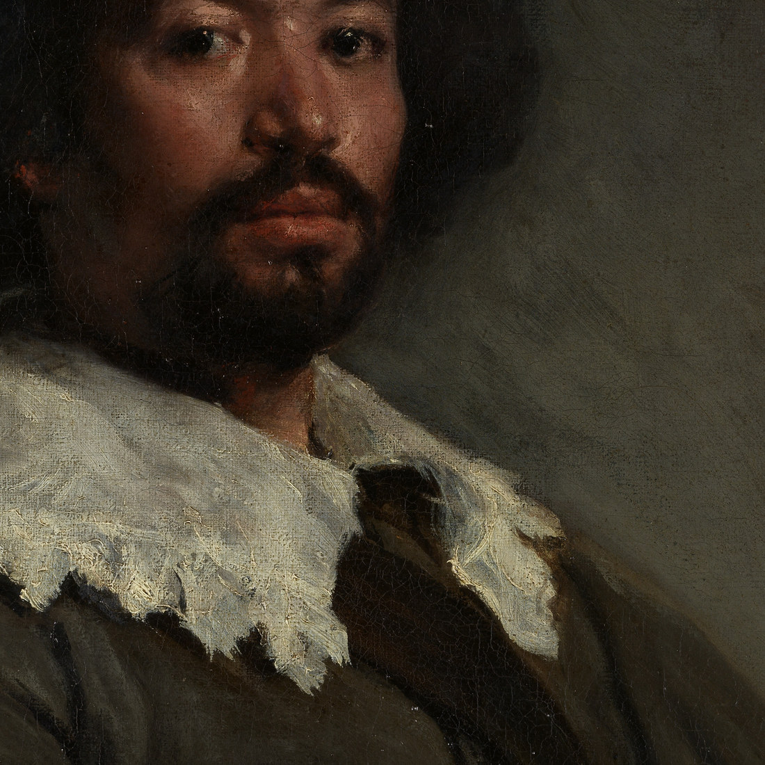 Velazquez, Juan de Pareja, 1650, oil on canvas, Metropolitan Museum of Art. The face and shadowed coat reveal a warm iron oxide ground glowing through restrained upper paint layers.