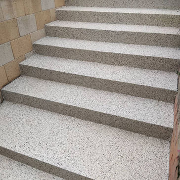 alt="Concrete steps resurfaced using textured non-slip polyaspartic coating designed for safety and durability in outdoor areas."