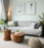a small room - small but spacious feeling living room with a muted colour palette, two minimalistic artwork pieces on the walls, with plants and ambient lamp