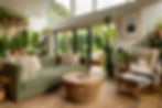 a biophilic interior design living room with green couch, grey chair and lots of houseplants