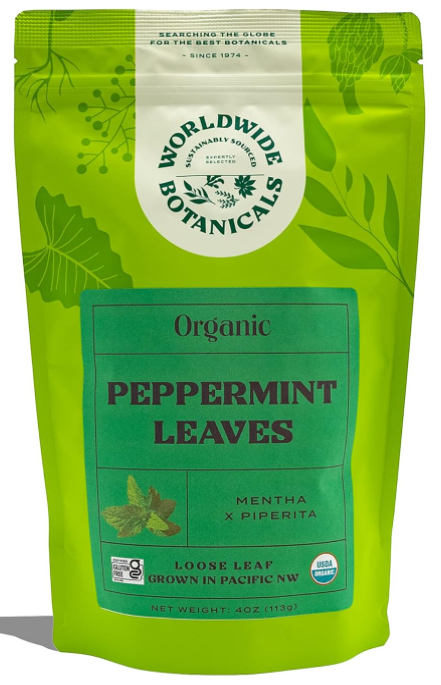 Green package of organic peppermint leaves by Worldwide Botanicals, featuring leaf illustrations and text. USDA Organic seal visible.
