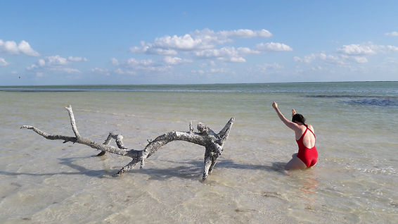 Ashley Meeder daning in sand on a beach in Holbox Island