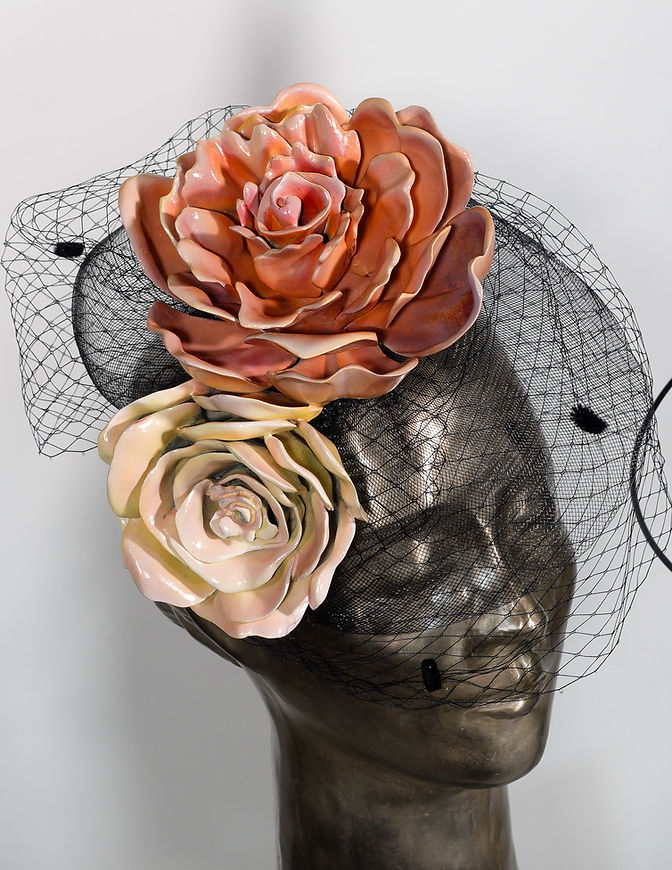 Us, bronze sculpture by Beatriz Gerenstein depicting a young woman wearing a veil and flowers beside a young man surrounded by orbital rings and a banana. The contemporary artwork explores feminine and masculine identity, human relationships, attraction, and symbolic thought.