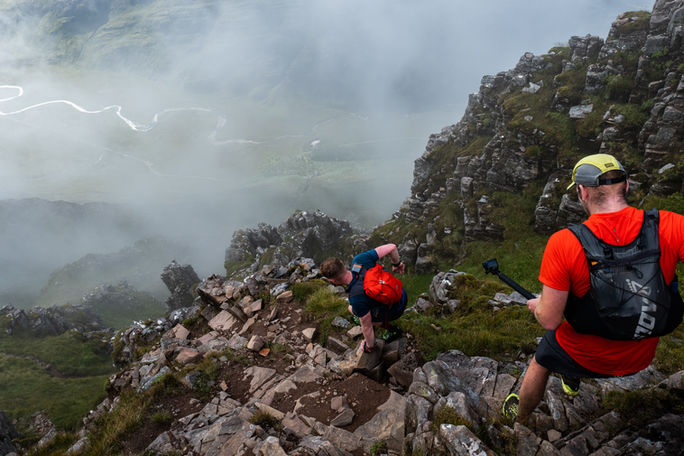 alt=“Robin Downie and support runners in the Torridon mountains, captured during the filming of the Martin Moran Round, a Mountain Equipment film produced by JHP Visuals"